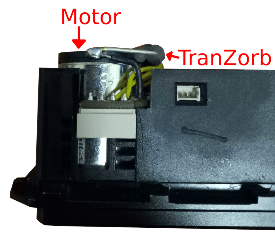 Side view of the mounted TranZorb. TranZorb arm is soldered on to the motor terminal along with the already existing motor connection, which is a black cable